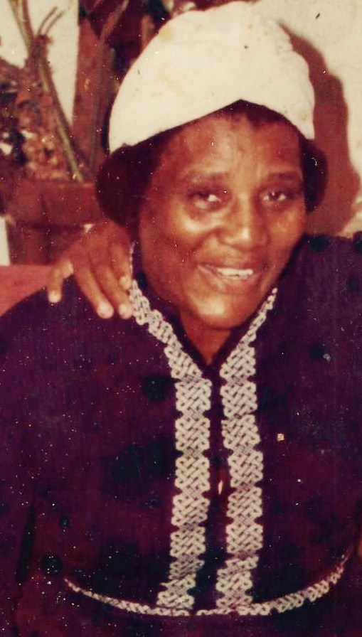 Mother Evangelist Virginia Siplin Smith in a white head wrap and dark dress with white braided trim